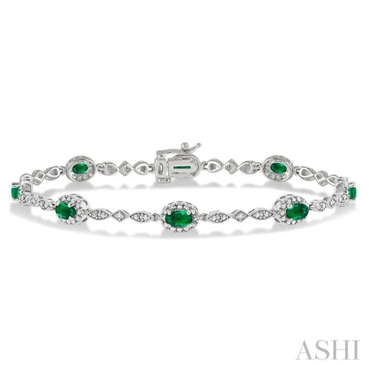 women’s colorful bracelets-5x3MM Oval Cut Emerald and 1/20 Ctw Single Cut Diamond Bracelet in 10K White Gold