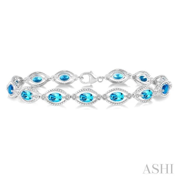 women’s cuff bangles-1/10 Ctw Round Cut Diamond & 6x4MM Oval Cut Blue Topaz Semi Precious Bracelet in Sterling Silver