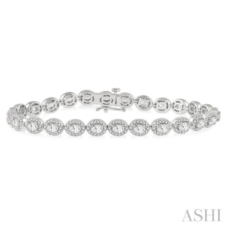 women’s luxury tennis bracelets-5 Ctw Oval & Round Cut Diamond Halo Bracelet in 14K White Gold