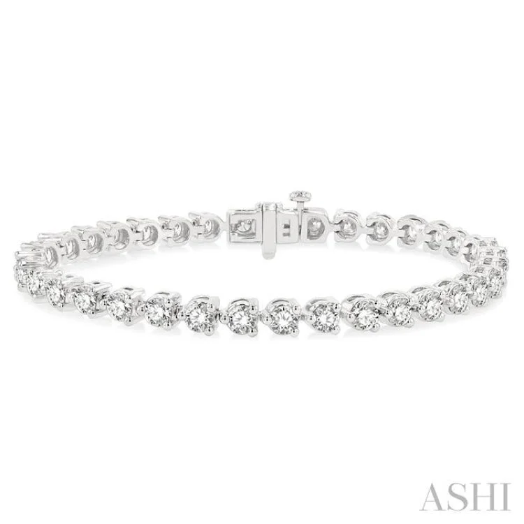 women’s diamond bangles-7 Ctw Tri-Prong Round Cut Diamond Bracelet in 14K White Gold