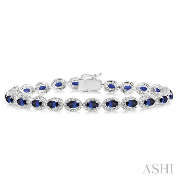 women’s crystal bangles-1 1/10 Ctw Oval Shape 5x3mm Sapphire & Round Cut Diamond Precious Stone Bracelet in 14K White Gold