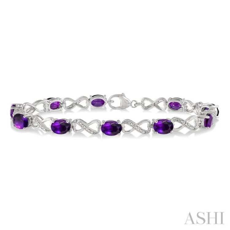 women’s stretch bracelets-1/10 Ctw Round Cut Diamond & 7x5MM Oval Cut Amethyst Semi Precious Infinity Bracelet in Sterling Silver